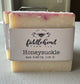 Bar of soap with 'fiddlehead farm LLC' label on a white surface