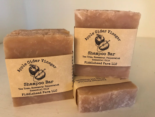 Brown apple cider vinegar shampoo bar. Handmade with handmade apple cider vinegar. Tea Tree Rosemary Peppermint essential oils. Shampoo bar. Beige color label with an apple on label.